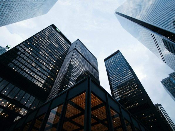 low angle photo of city high rise buildings during daytime